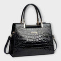 Olivia - Borsa a mano lucida con motivo coccodrillo