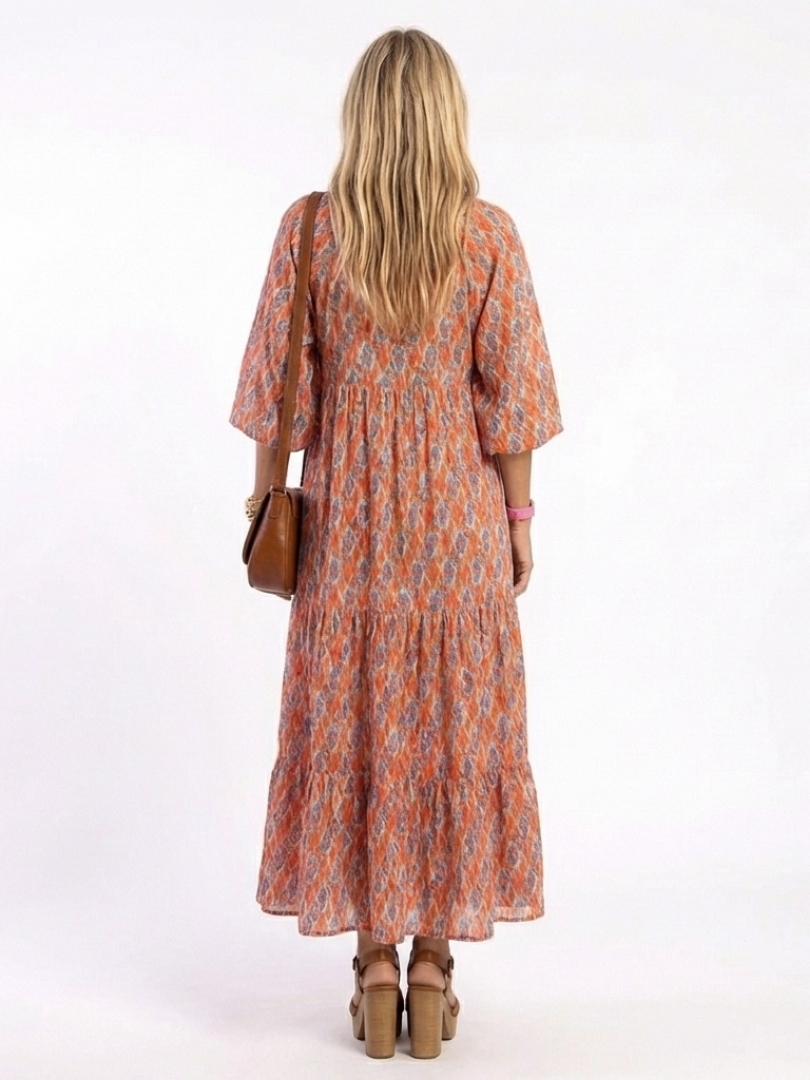 Amara | Vestido midi em camadas com estampa geométrica e decote em V