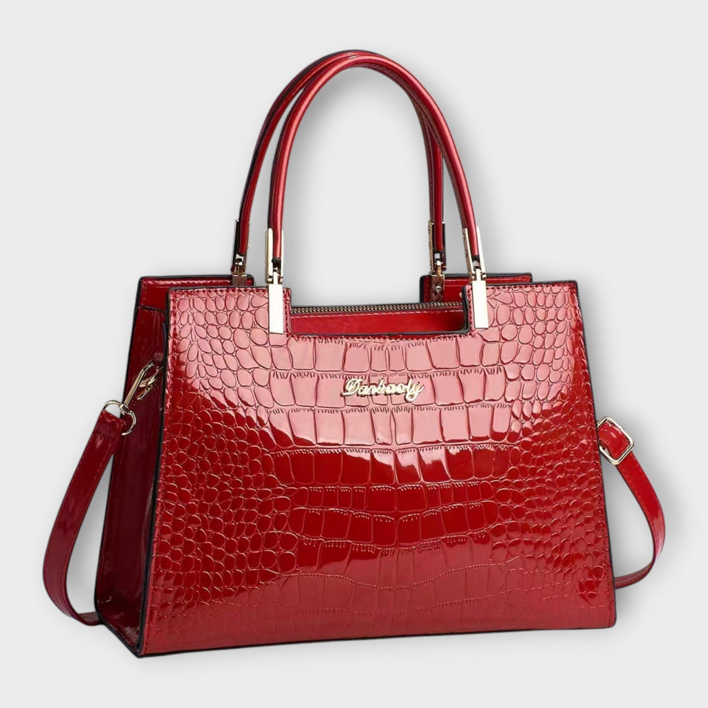 Olivia - Borsa a mano lucida con motivo coccodrillo