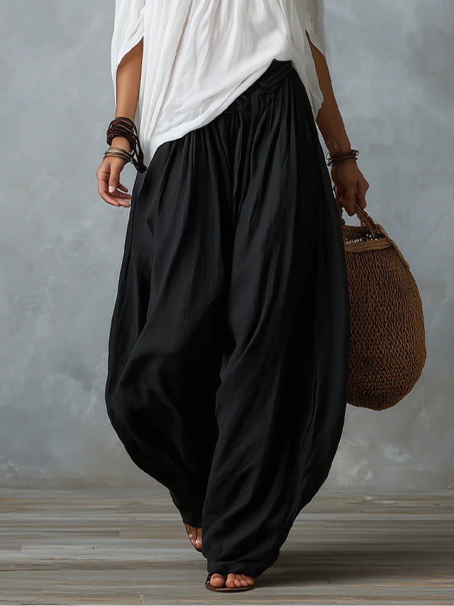 Conjunto branco de blusa ombro a ombro e calça pantalona soltinha
