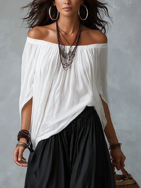 Conjunto branco de blusa ombro a ombro e calça pantalona soltinha