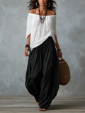 Conjunto branco de blusa ombro a ombro e calça pantalona soltinha